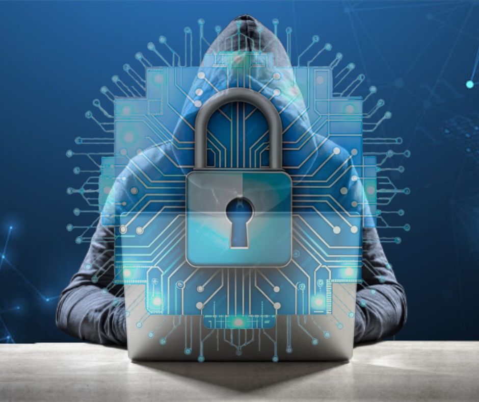A hooded figure sits at a laptop, surrounded by digital lock icons and circuitry, symbolizing cybersecurity and online threats.