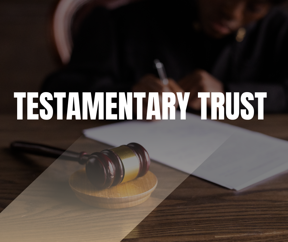 Gavel on a wooden surface next to a document, with a person in the background writing. Highlighting topics related to testamentary trusts and estate planning.